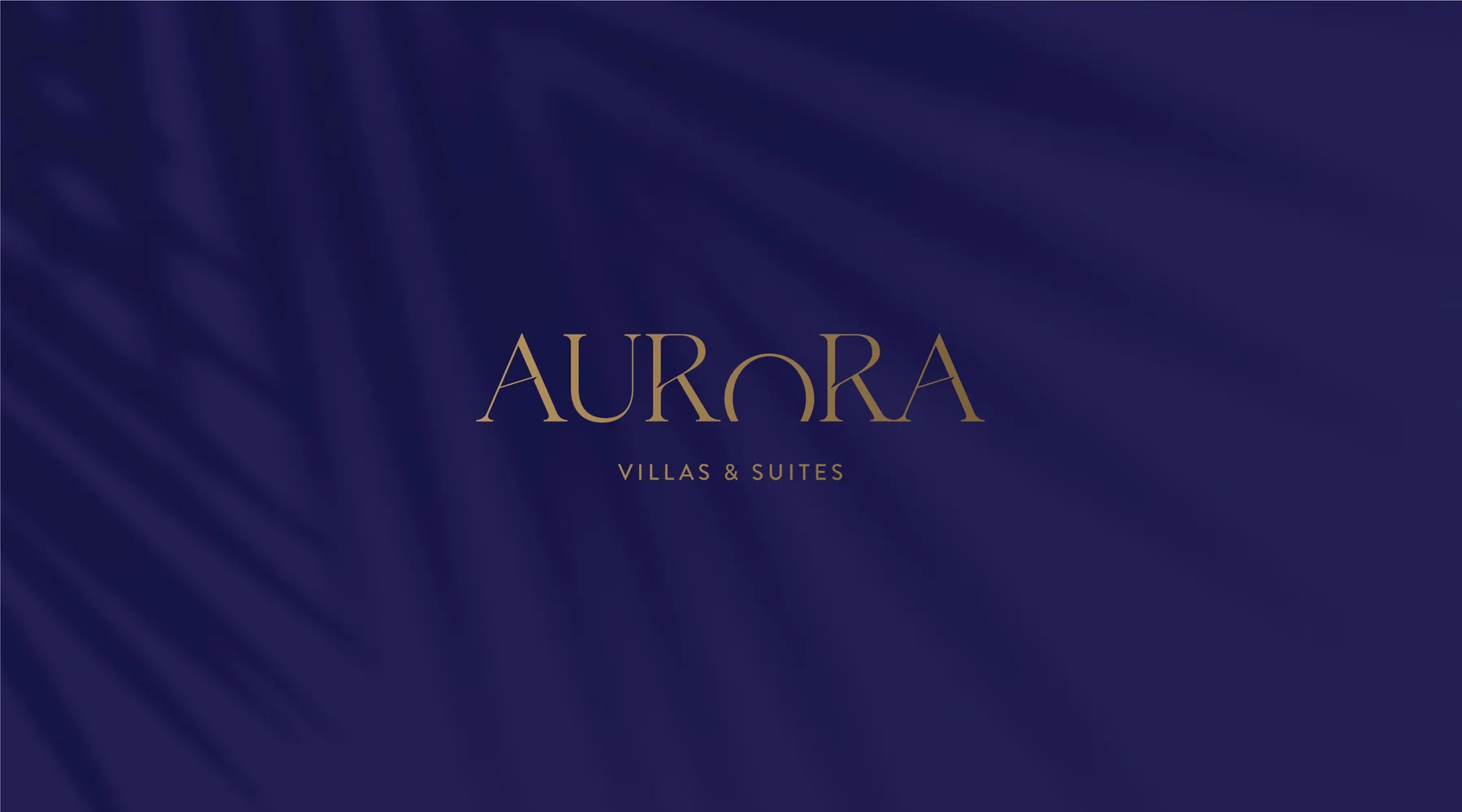 Aurora Villas and Suites wordmark in gold on a deep purple background with a subtle sunburst