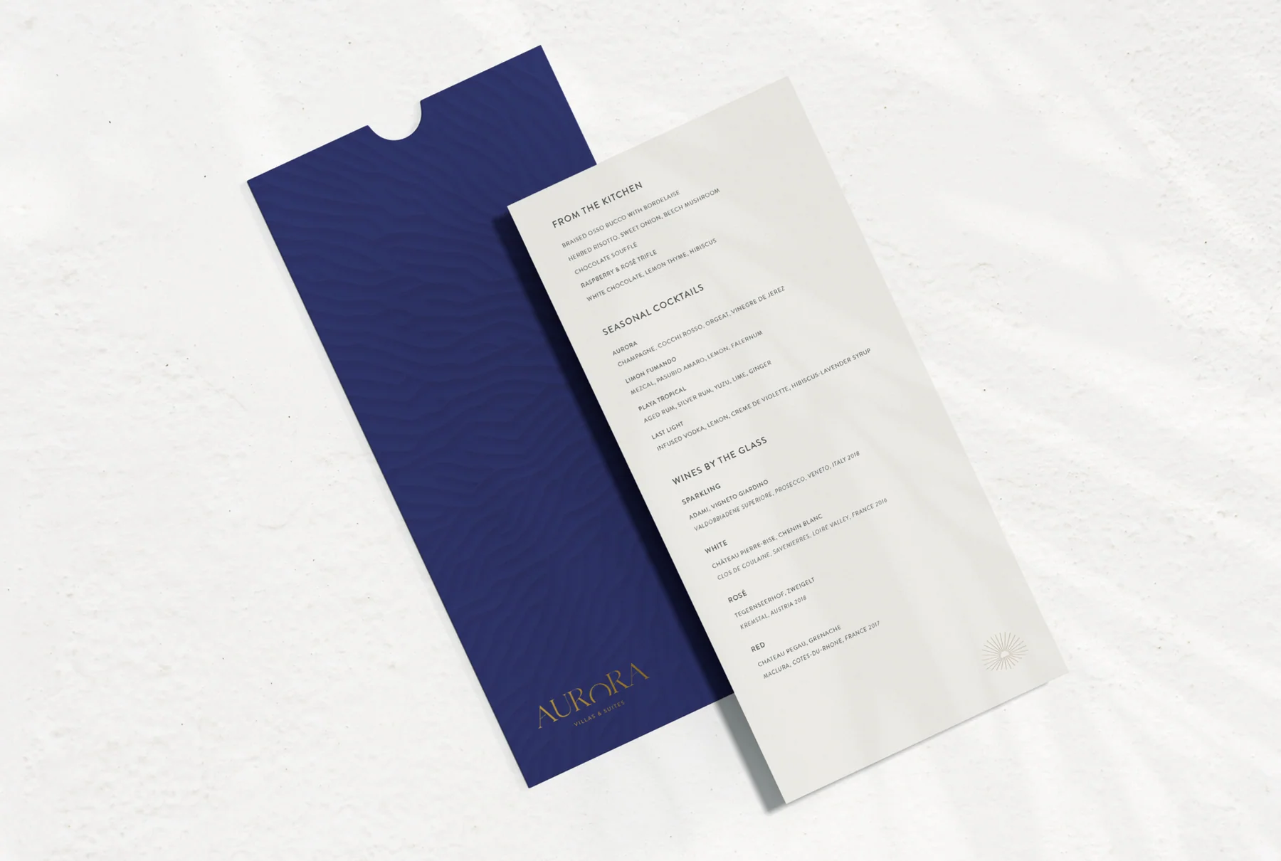 An Aurora menu mockup with a long white insert and deep purple sleeve